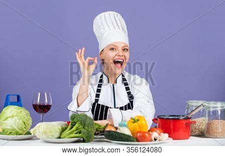 Just Perfect. Happy Smiling Chef Preparing Meal With Various Vegetables. Ready To Cook New Dish. Fre