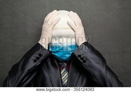 Incognito Man In A Medical Mask Is Dressed In A Business Suit