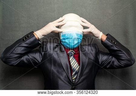 Incognito Man In A Medical Mask Is Dressed In A Business Suit