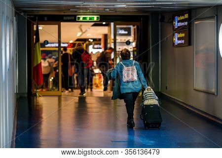 Otopeni, Romania - February 25, 2020: Passengers Inside Henri Coanda International Airport, Near Buc