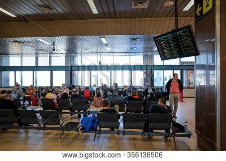 Otopeni, Romania - February 25, 2020: Passengers Inside Henri Coanda International Airport, Near Buc