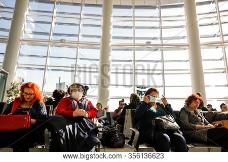 Otopeni, Romania - February 25, 2020: Passengers Inside Henri Coanda International Airport, Near Buc