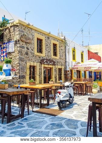 Kos, Greece - July 31, 2015: Taverns With Outdoor Seating In The Old Town Of Kos Town, The Capital O