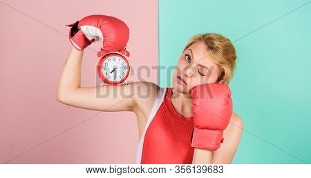 Control Time. Time Management Skills. Battle For Self Discipline. Woman Holding Clock Boxing Gloves.
