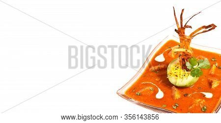Seasoned Traditional Tomato Soup With Fresh Avocado