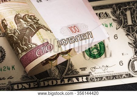 Russian One Hundred Rubles And One Dollar. Currency Devaluation Concept