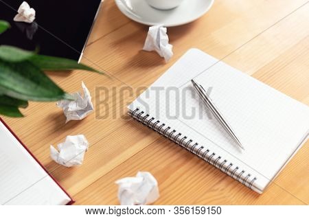 Writer Workplace With Notepad And Pen. Crumpled Papers, Clear Sheet In Notebook On Wooden Table. Bus