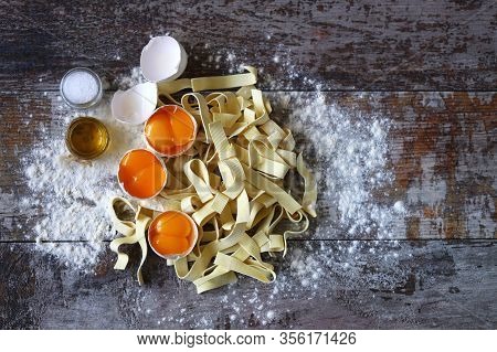 The Concept Of Cooking Egg Noodles. Raw Noodles, Eggs, Flour. Egg Noodles.