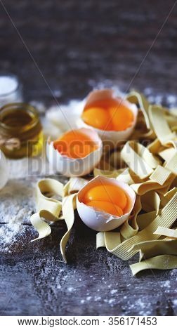 The Concept Of Cooking Egg Noodles. Raw Noodles, Eggs, Flour. Egg Noodles.