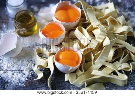 The Concept Of Cooking Egg Noodles. Raw Noodles, Eggs, Flour. Egg Noodles.