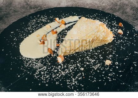 Cheesecake With Almonds And Coconut Shvings On Top
