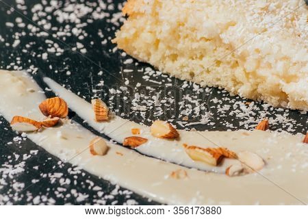 Cake With Almonds And Coconut Shvings On Top