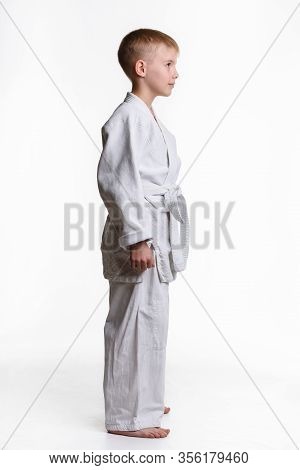 Side View Of An Athlete Dressed In A White Mastiff