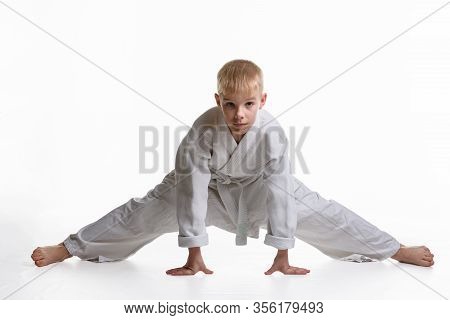Karate Boy Tries To Sit On A Twine