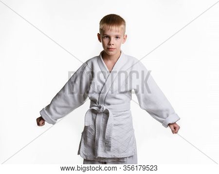 Portrait Of An Athlete Boy In A White Mastiff, With Arms Divorced