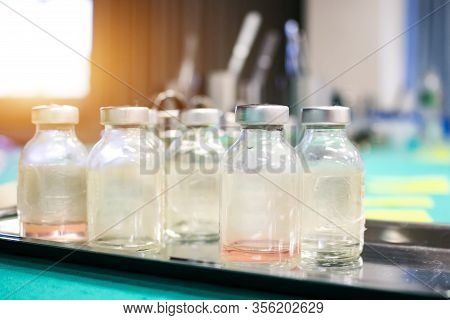The Vaccine Vial With Zeal Cap Use For Testing Corona Virus (covid-19) In Laboratory. Medical Work P