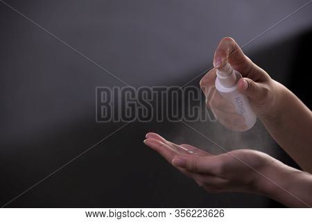 Hands Spraying Alcohol Hand Sanitiser For Disinfection Hygiene And Protection Against Covid-19 And O