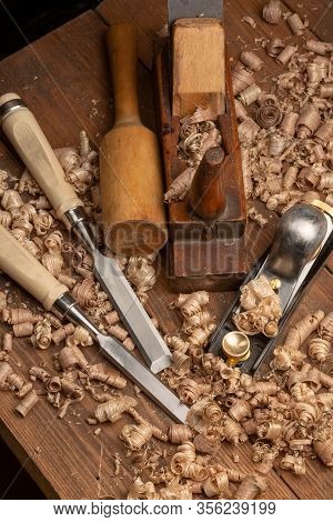 Chisel And Small Block Plane With Wood Shavings