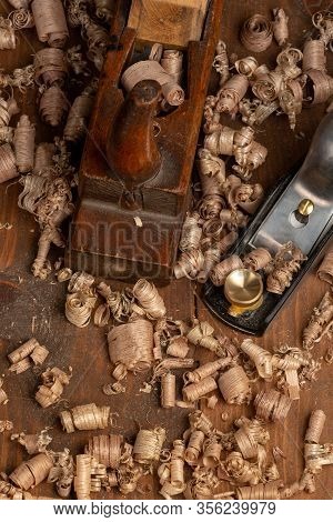 Chisel And Small Block Plane With Wood Shavings