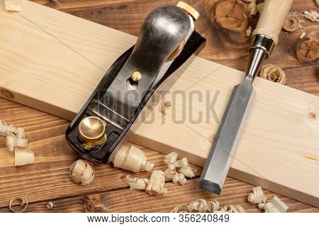 Chisel And Small Block Plane With Wood Shavings