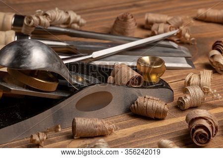 Chisel And Small Block Plane With Wood Shavings
