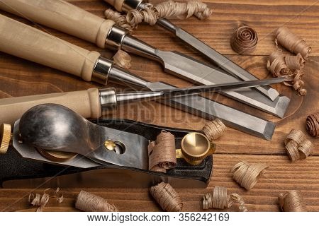 Chisel And Small Block Plane With Wood Shavings