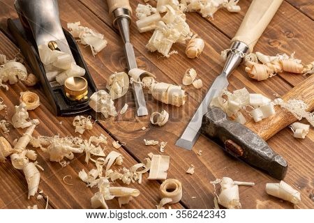 Chisel And Small Block Plane With Wood Shavings