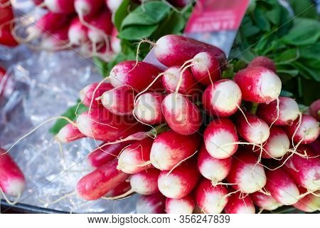 Fresh Radishes On Sale On A Market Stall