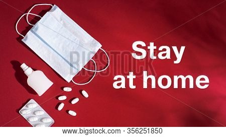 P Revention Of C Oronavirus. Medical Masks, Vitamins, Antiseptic On A Red Background. Label Stay At 