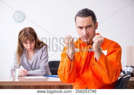 Young man meeting with advocate in pre-trial detention