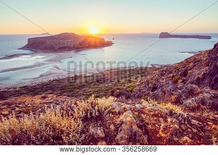 Island Gramvousa and the beautiful Balos beach on sunset in Crete island, Greece. Horizontal camera pan