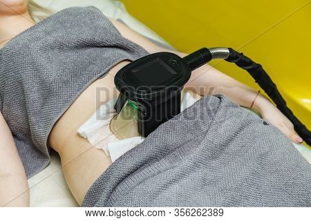 Woman Getting Cryolipolysis Fat Treatment Procedure In Beauty Salon