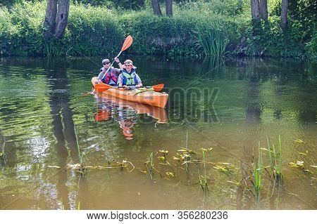 A Man And A Woman Floating On A Kayak, Tourists To Raft On A Canoe On The River, Angrapa River, Kali