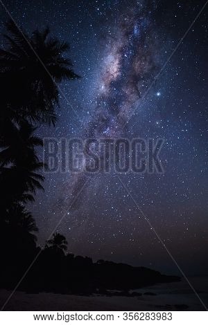 Clear Milky Way In The Dark Sky With Millions Of Stars On A Pristine Beach. Semau Island, Indonesia