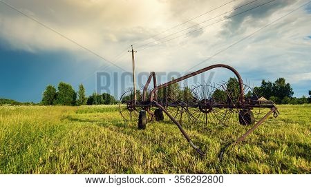 An Old Sweeper. Old Agricultural Equipment. Making Hay Drying And Turning The Hay