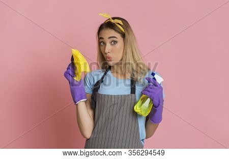 Funny Housewife Blowing Lips. Holds Spray And Rag In Hands, Free Space