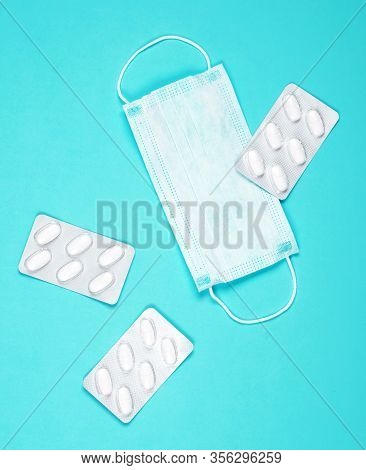 P Revention Of C Oronavirus. Medical Masks, Vitamins On A Blue Background.