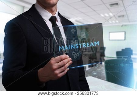 Business, Technology, Internet And Network Concept. Young Businessman Working On A Virtual Screen Of