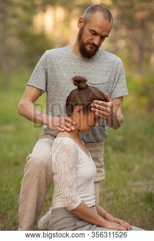 Yumeiho Massage. Masseur Young Man Doing Oriental Japanese Massage Yumeiho Girl. Concept Of Health, 