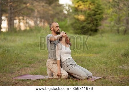 Yumeiho Massage Therapy. Masseur Young Man Doing Oriental Japanese Massage Yumeiho Girl. Concept Of 