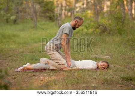 Yumeiho Massage Therapy. Masseur Young Man Doing Oriental Japanese Massage Yumeiho Girl. Concept Of 