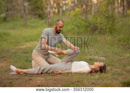 Yumeiho Massage Therapy. Masseur Young Man Doing Oriental Japanese Massage Yumeiho Girl. Concept Of 