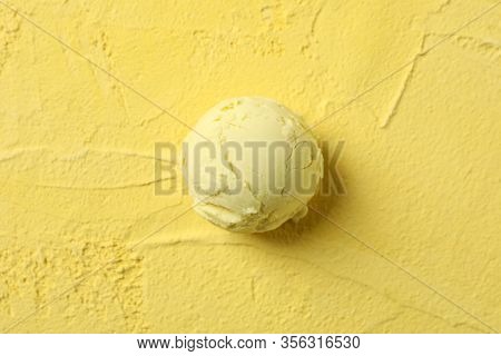 Ice Cream Ball On Yellow Background, Close Up