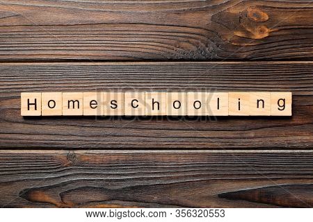Homeschooling Word Written On Wood Block. Homeschooling Text On Wooden Table For Your Desing, Top Vi