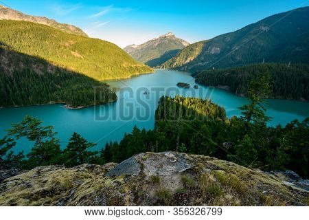 Rocks Above Diablo Lake On Calm Morning