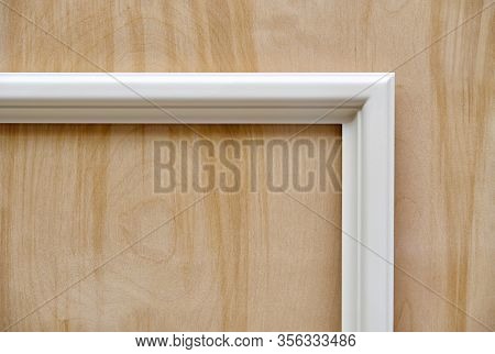 Wooden White Molding On Plywood Background. Wood Door Manufacturing Process. Furniture Manufacture.