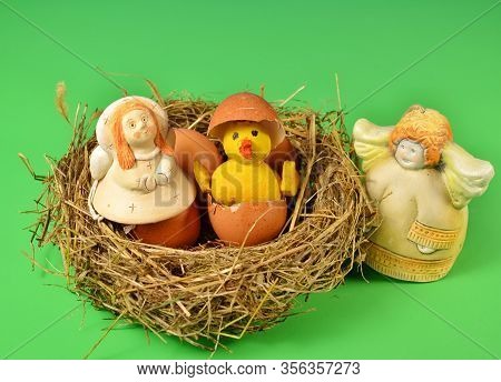 In A Straw Nest, Surrounded By Angels, A Chicken Hatched From An Egg