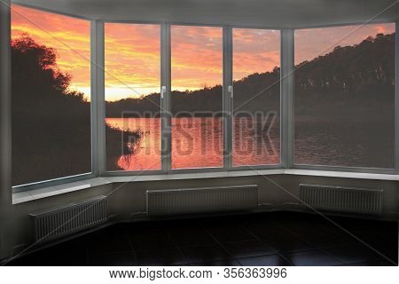 Plastic Windows Overlooking Beautiful Crimson Sunset Above River. View From Home Window At Sunset. C
