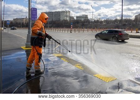 Road Worker Cleaning City Street With High Pressure Power Washer, Cleaning Dirty Public Transport St