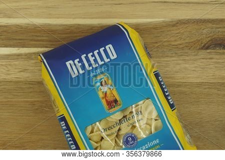 Zaandam, The Netherlands - March 17, 2020: Package Of De Cecco Pasta Against A Wooden Background.